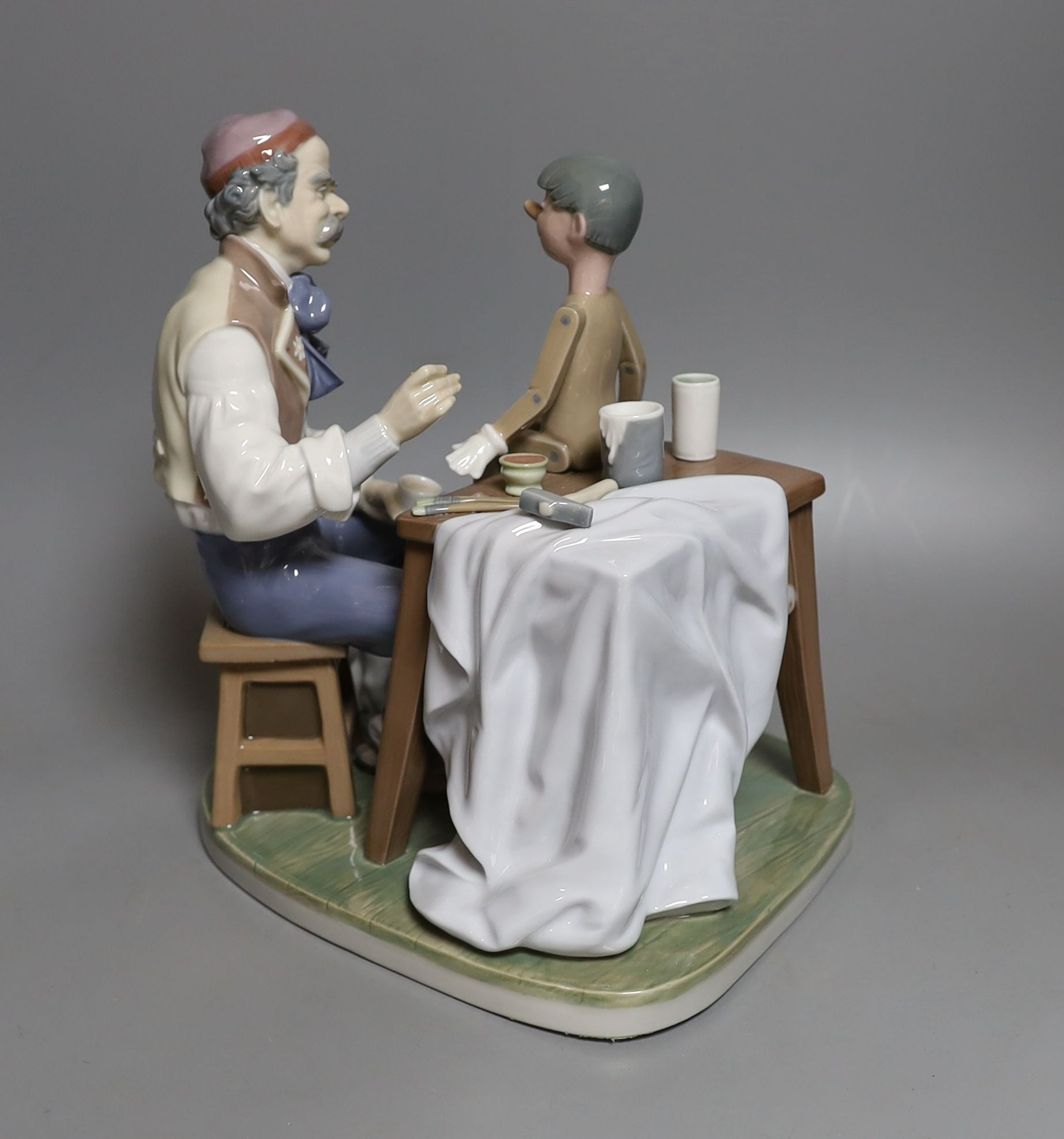 A Lladro group of Pinocchio and Giuseppe, impressed number 5396